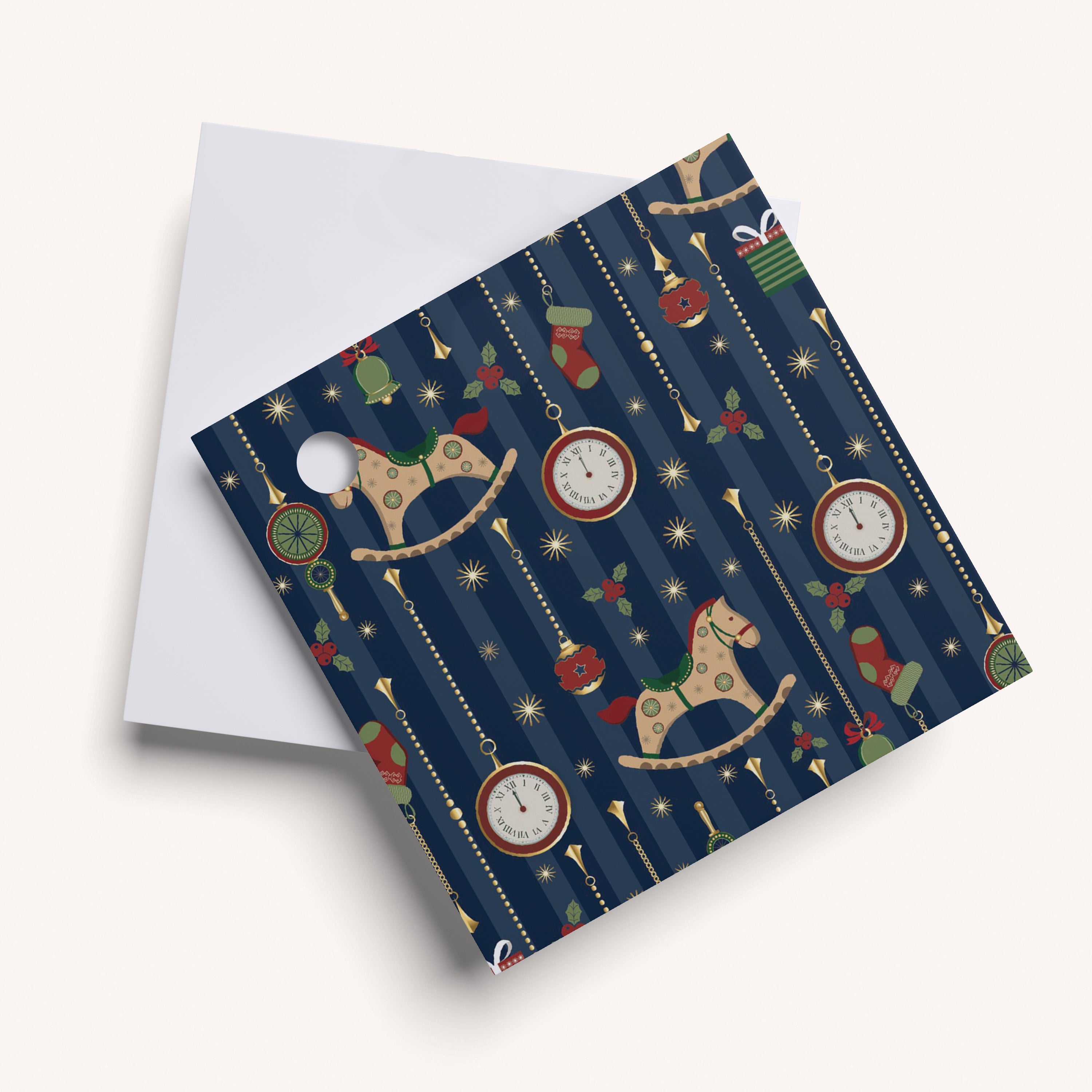 Name tag with decorative pattern of rocking horses, clocks, and stars on a blue striped background.