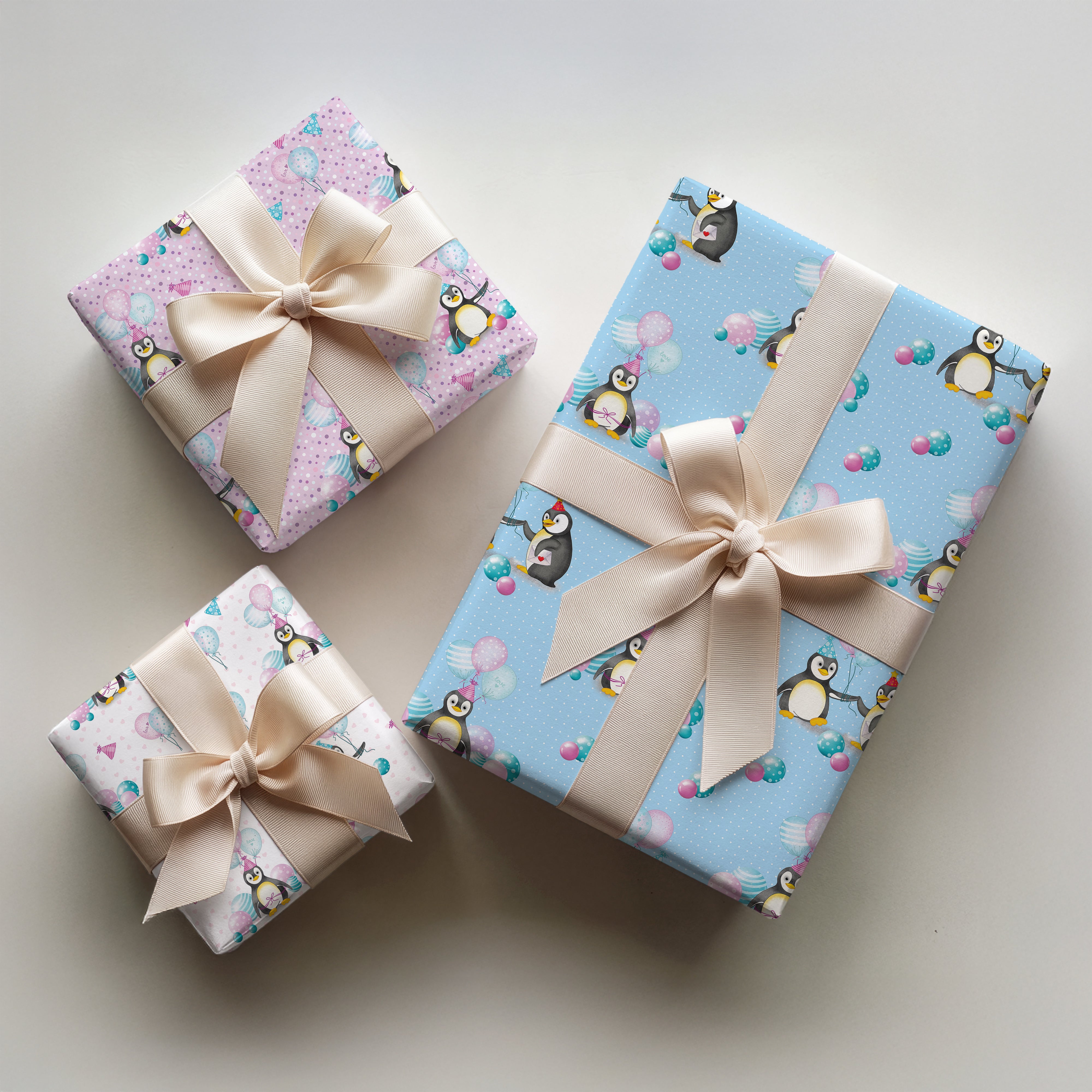 3 wrapped gifts in penguin birthday wrapping paper