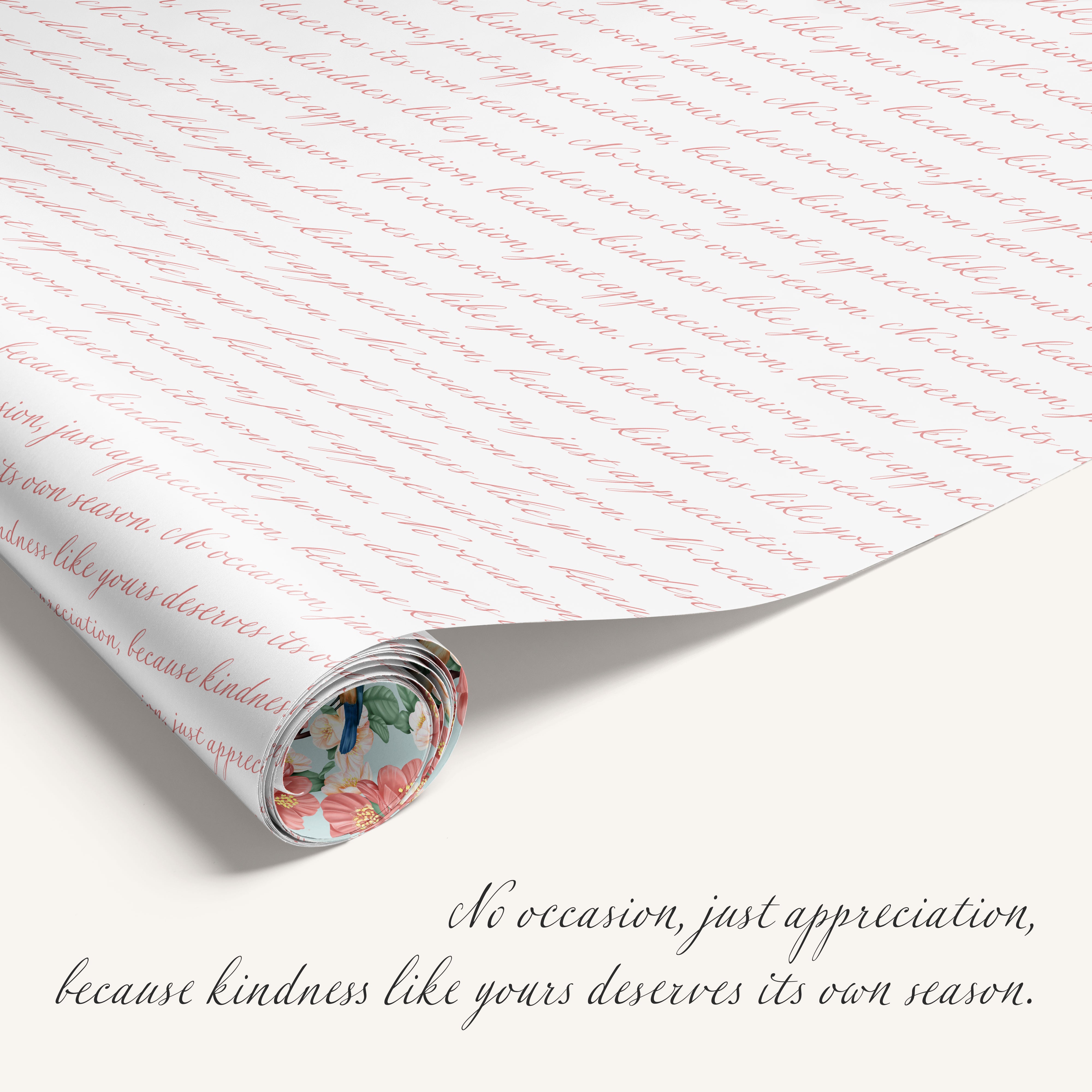 Rolled-up gift wrap with cursive text and a floral label, featuring a quote about kindness.