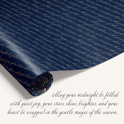 “Midnight Carousel” double-sided holiday wrapping paper featuring blue stripe design on one side and holiday text on the reverse.