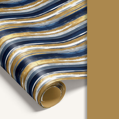 Double-sided wrapping paper featuring navy stripe design on one side and soft pastel gold reverse.