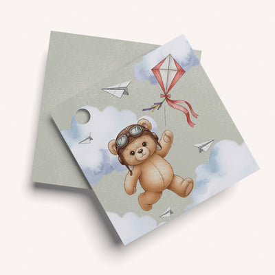 name card with a teddy bear design on a light green background