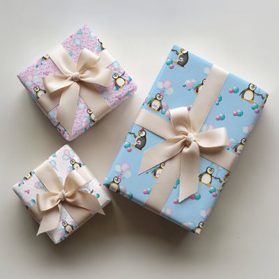 3 wrapped gifts in penguin birthday wrapping paper