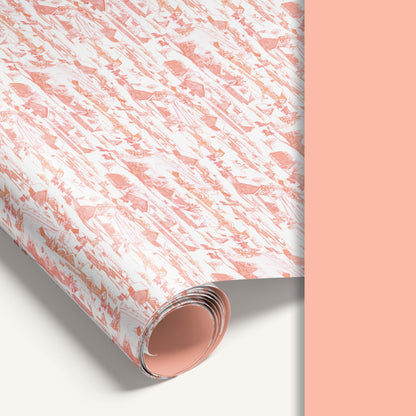 Winter Village double-sided wrapping paper featuring vintage snowy countryside illustration on one side and solid vintage pink reverse.
