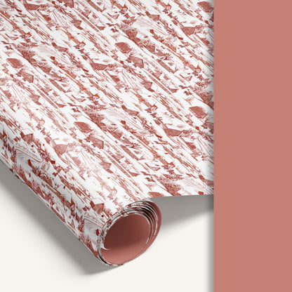 Winter Village double-sided wrapping paper featuring vintage snowy countryside illustration on one side and solid vintage soft red reverse.