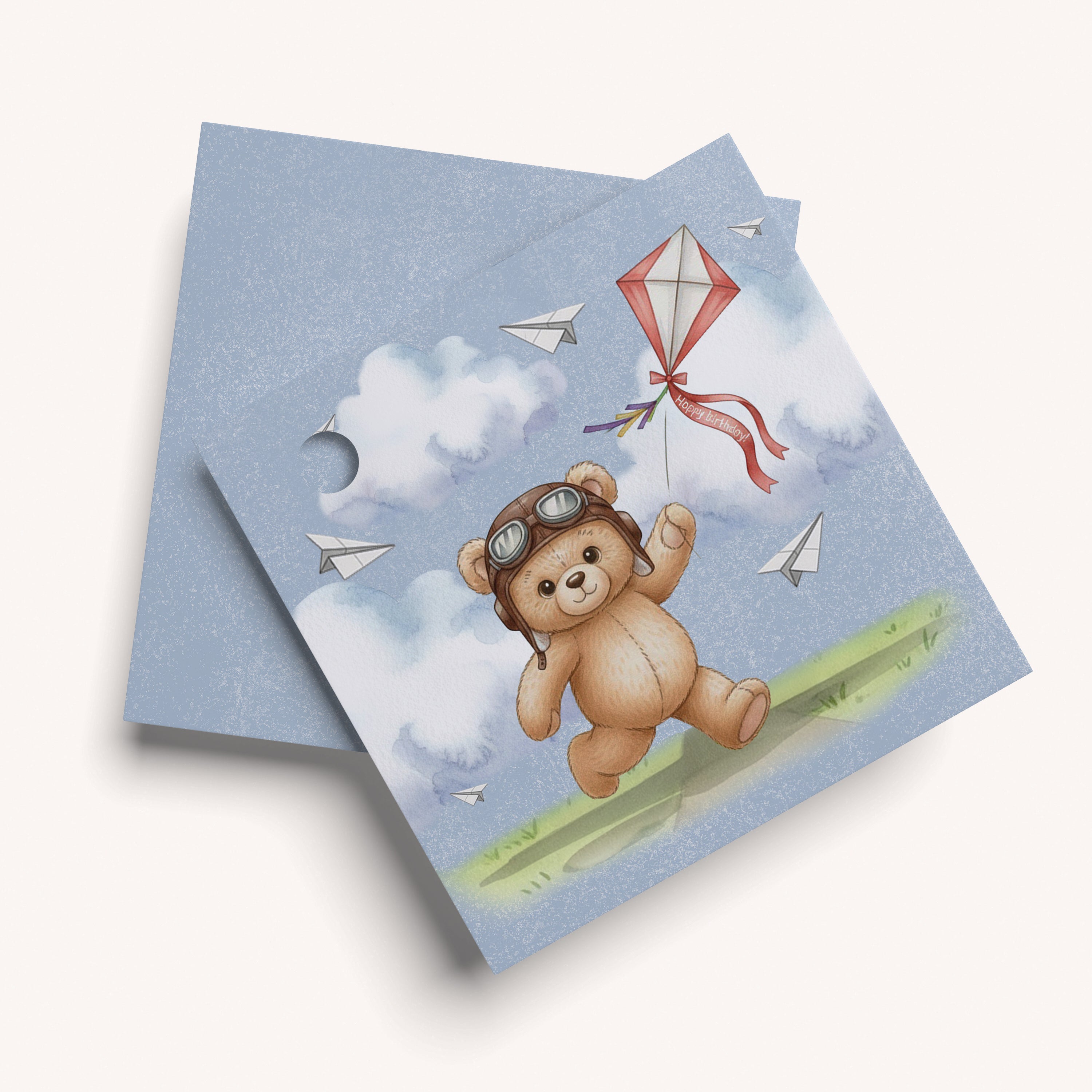 Name card with a teddy bear design on a blue background