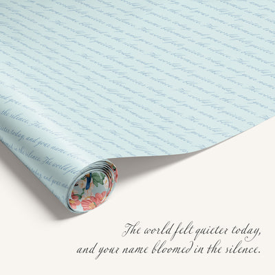 Roll of paper with floral design at the bottom and text on a light blue background