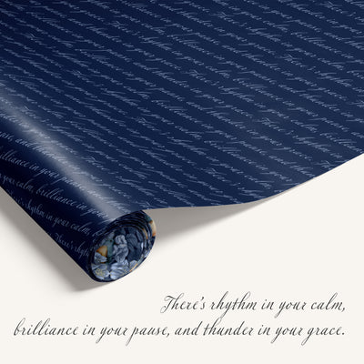 Roll of blue wrapping paper with text on a white background