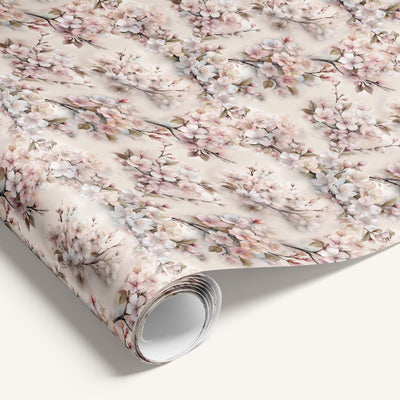 Roll of floral wrapping paper with cherry blossoms on a white background