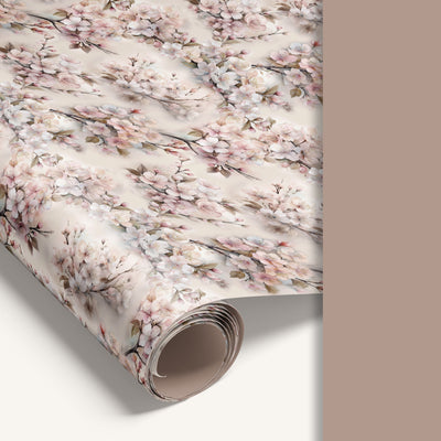 Rolled sheet of floral wrapping paper featuring soft pink and white blossoms.
